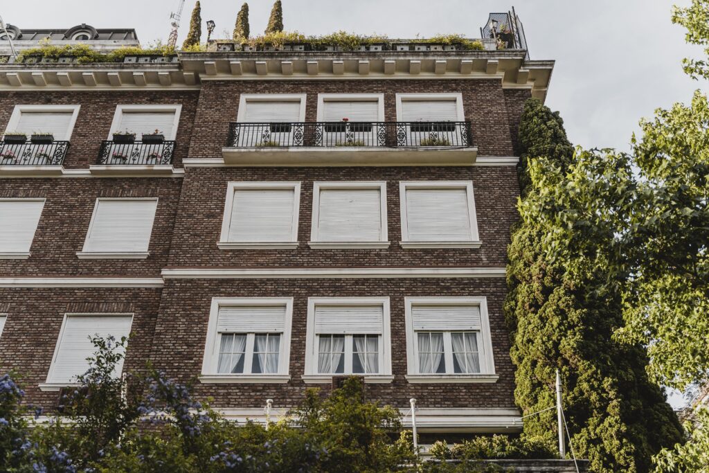 low angle apartment building with windows city